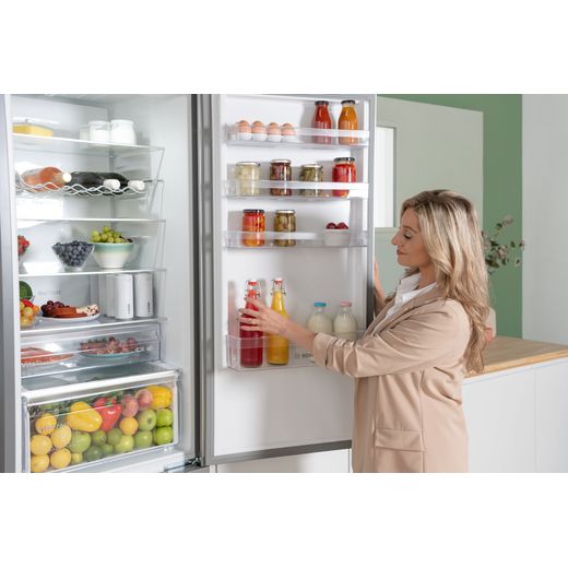 Bosch Series 4 KGN392LAGG 203cm 70/30 Fridge Freezer - Stainless Steel Effect - women using door shelf shot