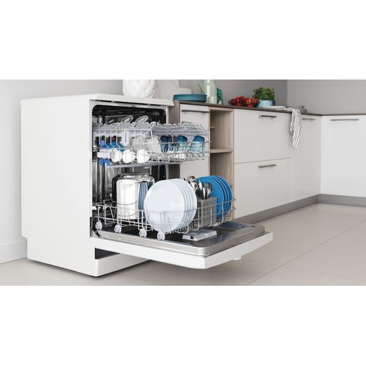 Indesit Standard Dishwasher - White  - Dishwasher in kitchen with door open shot 