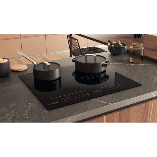 Hotpoint CleanProtect TS8660CCPNE 59cm Induction Hob - Black - Hob in kitchen with pans on