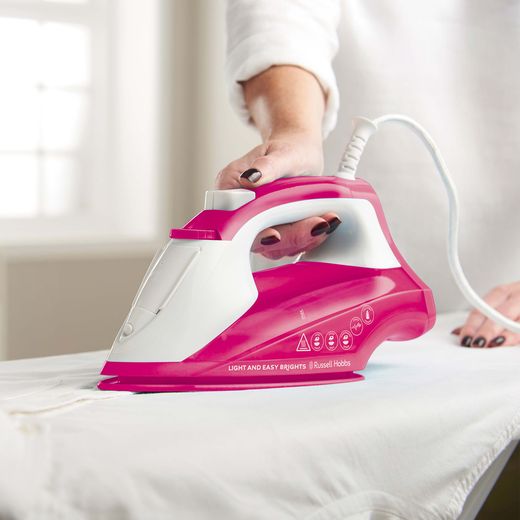 Russell Hobbs Light & Easy Brights 26480 Iron -Berry - Person ironing clothes shot