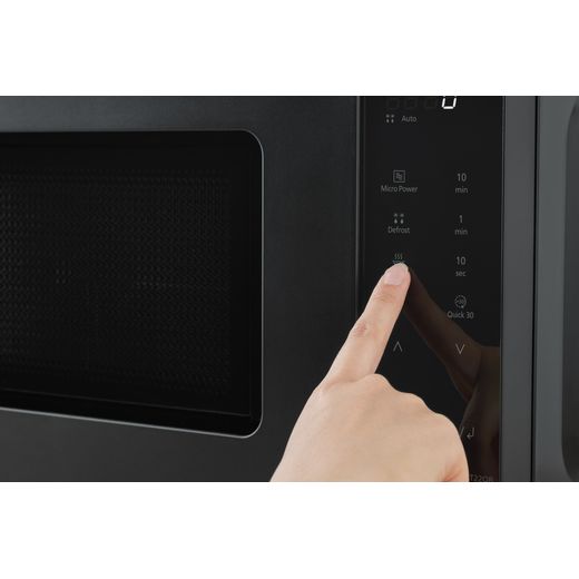 Panasonic NN-ST22QBBPQ Microwave Black - Person suing microwave shot