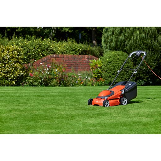 Flymo EasiStore 380R Corded Lawn Mower - Sunset Orange - mower in garden shot