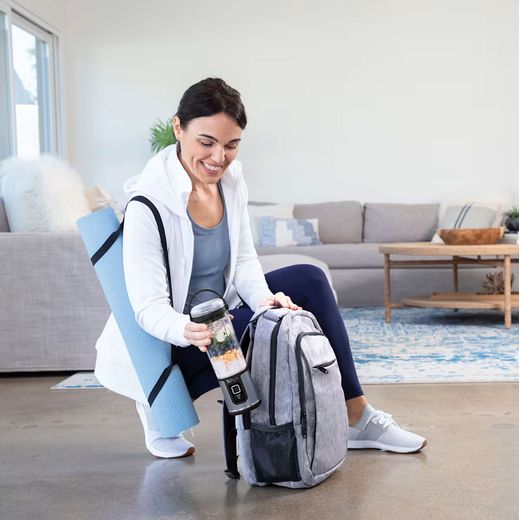 Ninja Blast BC151UKBK Portable Blender - Black - Woman putting blender in bag