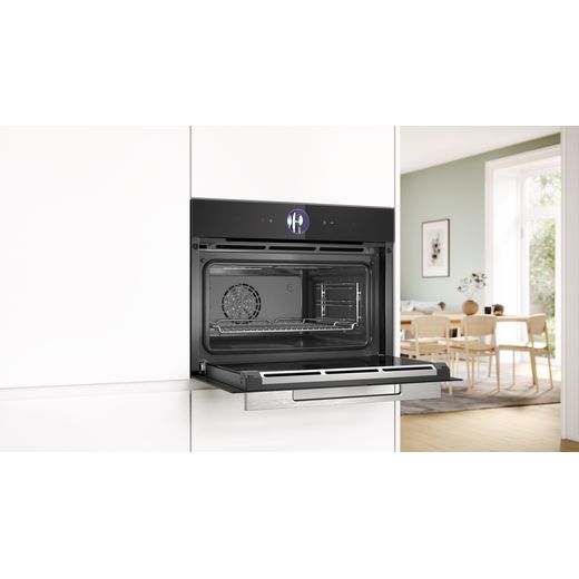 Bosch Series 8 Compact Electric Single Oven - Black  - Oven in kitchen with door open shot