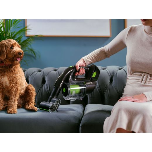 Gtech Multi K9 1-03-195 Cordless Vacuum Cleaner with up to 20 Minutes Run Time - pixel -  Women hoover sofa shot