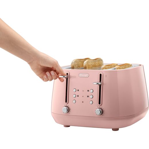 De'Longhi Eclettica CTY4003.PK 4 Slice Toaster - Pink - Person using toaster shot