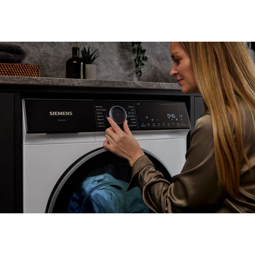 Siemens IQ-500 WQ46H2D9GB 9Kg Heat Pump Tumble Dryer - White - women using tumble dryer