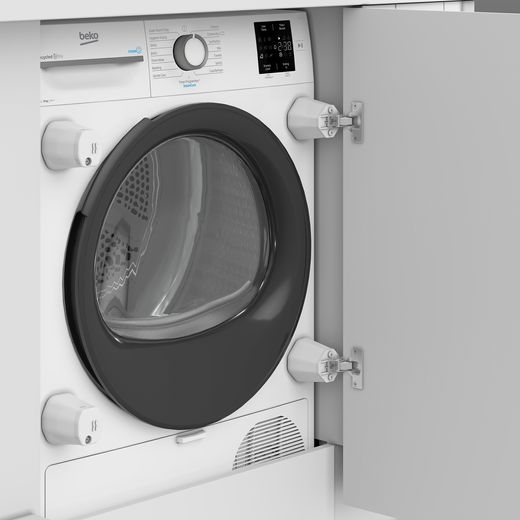 Beko NTIKP81131W Integrated Heat Pump Tumble Dryer - White - Machine in cupboard shot