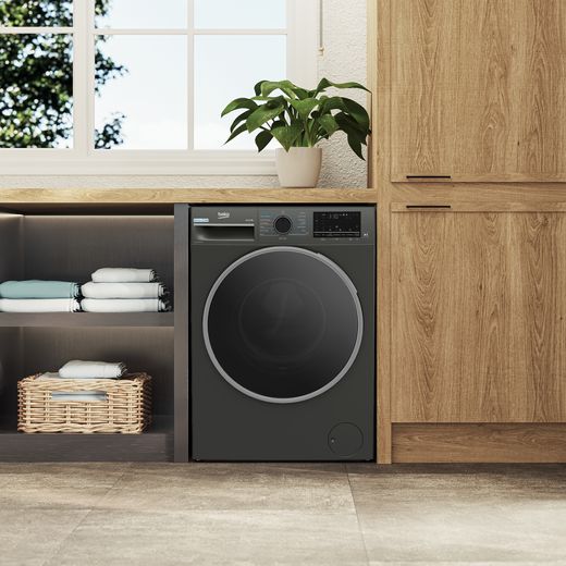 Beko EnergySpin™ B5W5941BDG 9kg Washing Machine with 1400 rpm - Graphite - Washing machine in utility room shot