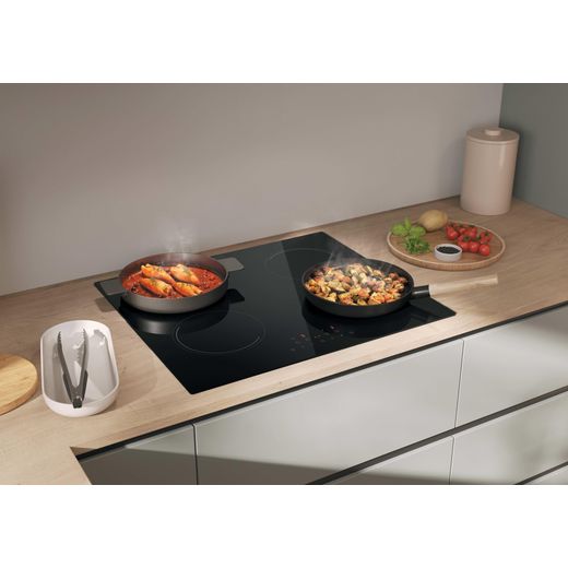 Candy Idea CII647CCAR 59cm Induction Hob - lifestyle - right perspective of hob in situ in kitchen with food in pans on top