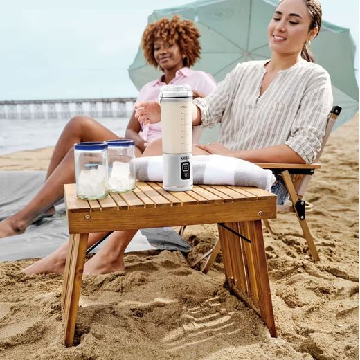 Ninja Blast BC151UKWH Portable Blender - White - Woman using blender on beach