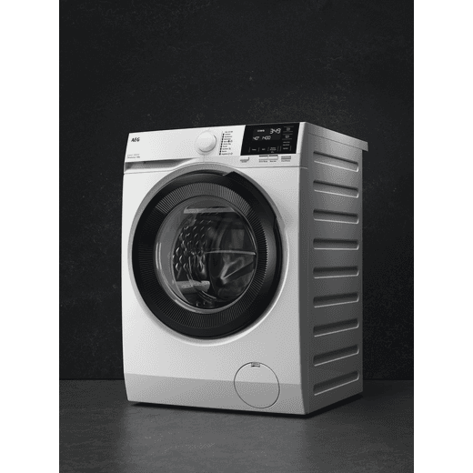 AEG ProSense® Technology 9Kg Washing Machine - White - Washing machine in dark room