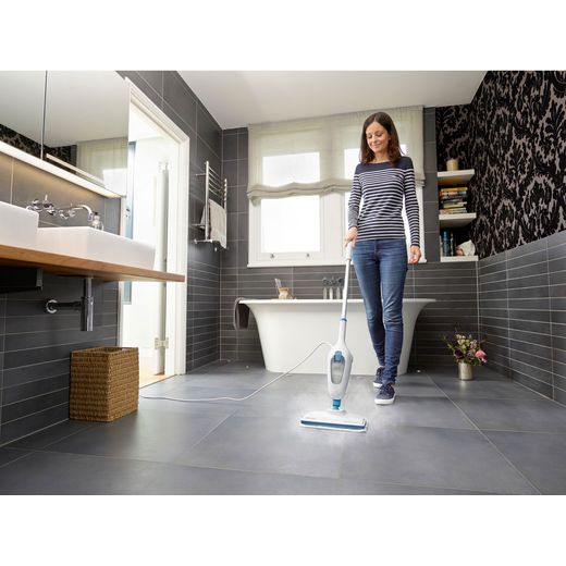 Black + Decker FSM13E1-GB Steam Mop with up to 15 Minutes Run Time - White - Women cleaning bathroom shot