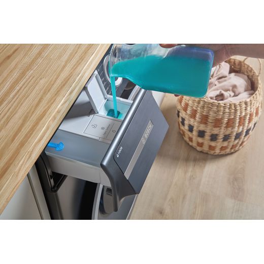 Bosch Series 6 i-Dos WGH254ARGB 10kg WiFi Connected Washing Machine with 1400 rpm - Graphite - person filling machine shot