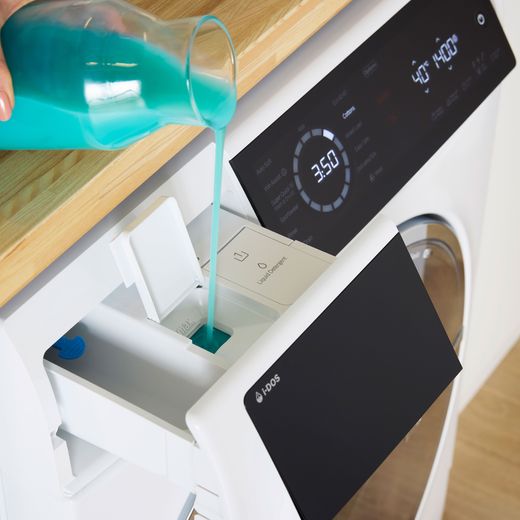 Bosch Series 8 i-Dos 10.5Kg / 6Kg Washer Dryer - White - Person adding solution shot