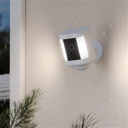 Ring Battery Powered Spotlight Cam Plus Full HD 1080p Smart Home Security Camera - White - Camera on wall at night with light on shot