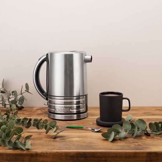 Dualit Architect 72905 Kettle - Black / Brushed Steel - Kettle on worktop next to mug