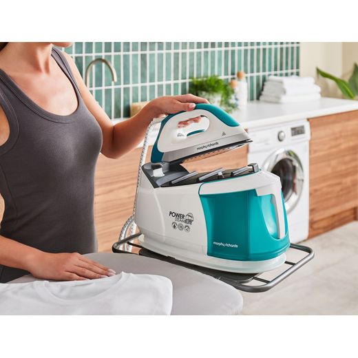 Morphy Richards Power Steam Elite With AutoClean Pressurised Steam Generator Iron - White / Green - Putting iron on base