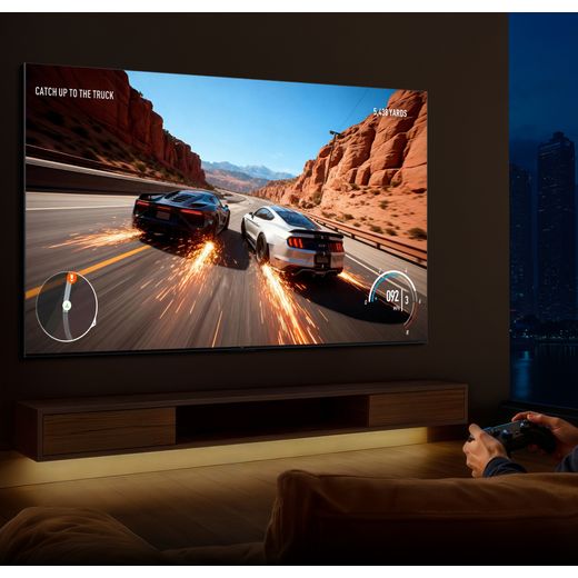 TCL 98" 4K Ultra HD SQD-Mini LED Smart Google TV [2026] - 98C7L-UK - lifestyle - in living room playing racing game on tv