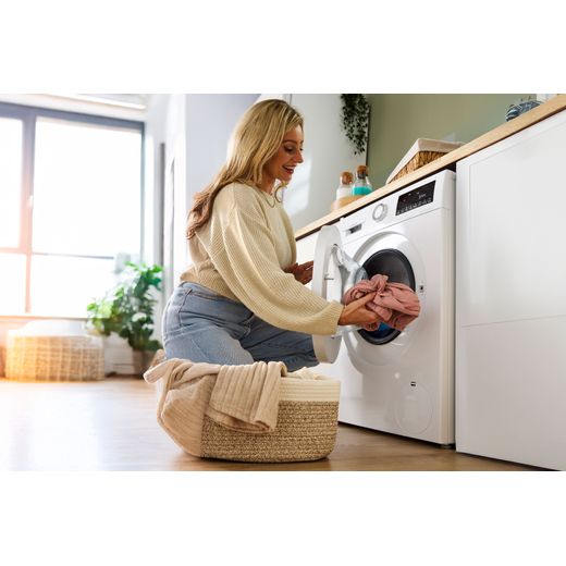 Bosch Series 4 9Kg / 5Kg Washer Dryer - White - Women loading up washing shot