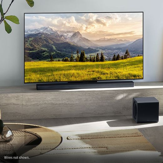 Samsung Q-Series HW-QS700F Bluetooth Soundbar - Obsidian Black - Soundbar on stand in room