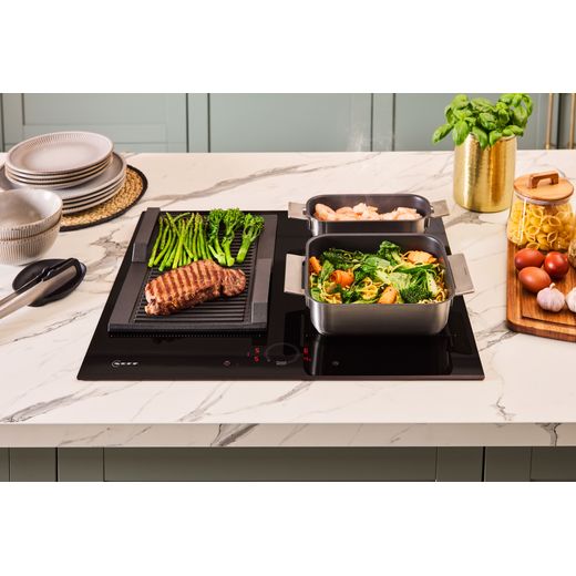 NEFF N70 T66FHX4L0 59cm Induction Hob - Black - food cooking on hob shot
