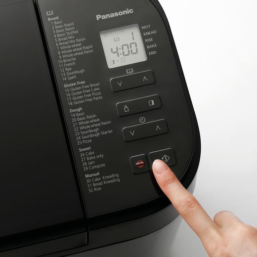 Panasonic Bread Maker - Grey - person using bread maker shot 