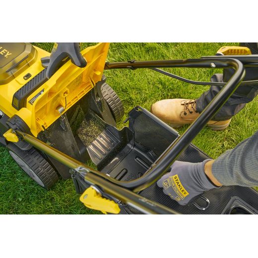 Stanley Fatmax V20 Cordless Lawn Mower - lifestyle - person holding grass collector