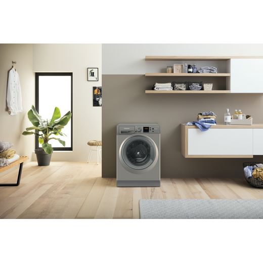 Hotpoint Anti-Stain NSWM 846 GG UK 8kg Washing Machine with 1400 rpm - Graphite - Washing machine in utility room shot