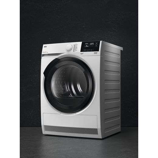 AEG 8000 AbsoluteCare® TR819A4B 9Kg Heat Pump Tumble Dryer - White - Annotation - Tumble dryer in dark room