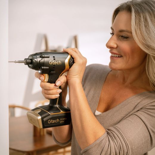 Gtech 1-12-031 Tool Black / Gold - Woman using drill