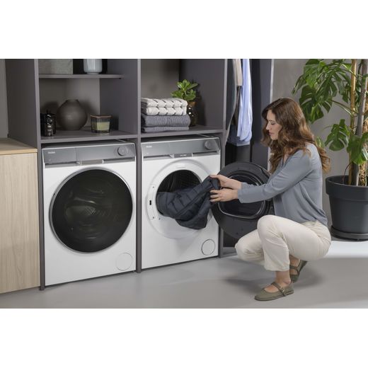 Haier X9 Condenser Tumble Dryer - White - Women using tumble dryer shot 