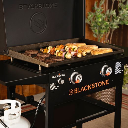 Blackstone 28in Griddle with Hood Gas Barbecue - Black - Food cooking on grill shot