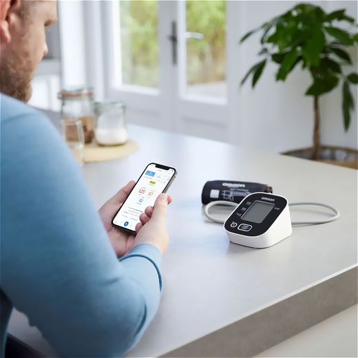Omron HEM-7146T2-EBK Upper arm Blood Pressure Monitor - Man using blood pressure machine shot