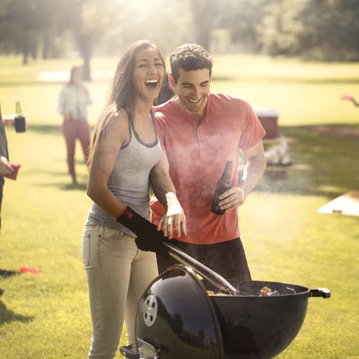 Weber Bar-B-Kettle, 47 cm Charcoal Barbeque - Black - People cooking on BBQ