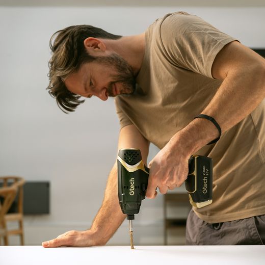 Gtech 1-12-031 Tool Black / Gold - Man using drill