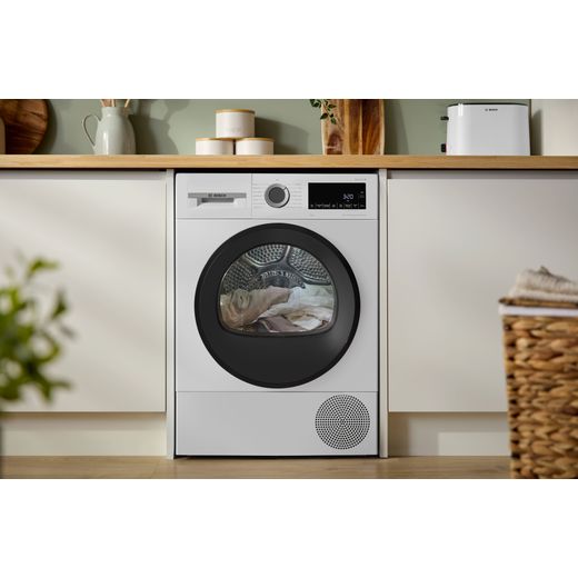 Bosch Series 6 WQG24502GB 9Kg Heat Pump Tumble Dryer - White - machine in kitchen shot