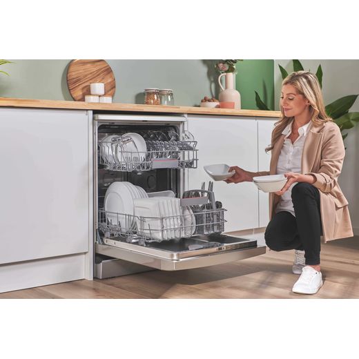 Bosch Series 4 Standard Dishwasher - Silver Inox - Woman filling dishwasher