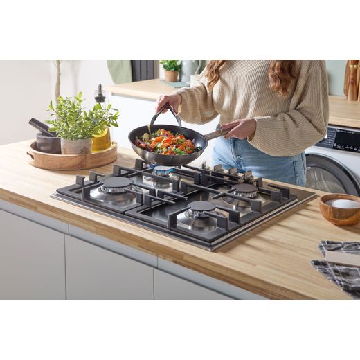 Bosch Series 6 PCP6A5I90 58cm Gas Hob - Stainless Steel - Women cooking food shot